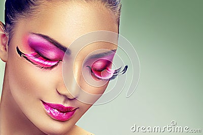 Creative holiday makeup with false long purple eyelashes Stock Photo