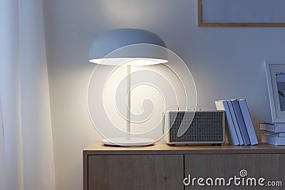 Creative home office interior with lamp and books Stock Photo