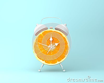 Creative idea layout fresh orange slice alarm clock on pastel bl Stock Photo