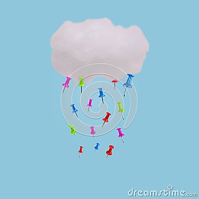 Creative idea made with cloud and push pins as rain isolated against bright blue background Stock Photo