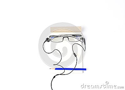 Creative idea Men face with Eyeglasses and blue pencil and Notepad with ear phone Stock Photo