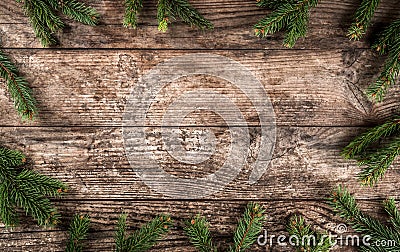 Creative layout frame made of Christmas fir branches, pine cones on wooden background. Stock Photo