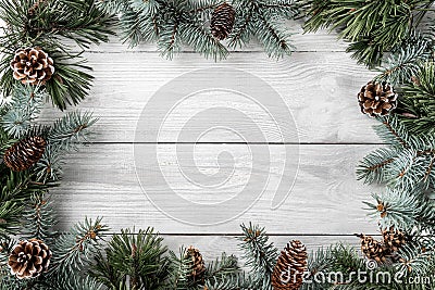 Creative layout frame made of Christmas tree branches and pine cones on white background. Xmas and New Year theme. Stock Photo