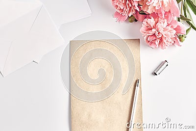 creative layout. office desk. home female workspace. a stack of envelopes and a notepad with a pen. Stock Photo