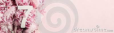 Creative layout. Pink peony flowers and digit seven 7. Birthday greeting card. Anniversary concept. Top view. Copy space. Stylish Stock Photo