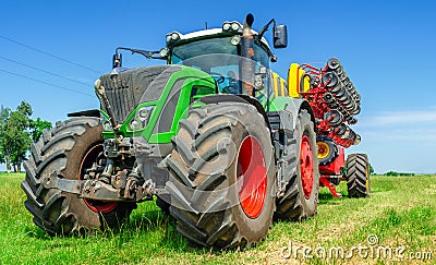 Creative look of a colored tractor seeder. Summer photo for advertisement of agricultural works Stock Photo