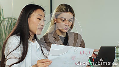 Creative, modern business womens in start-up team meeting. Office with young multi-racial innovative entrepreneurs Stock Photo
