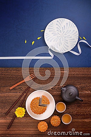 Creative Moon cake Mooncake design inspiration, enjoy the moon in Mid-Autumn festival with pastry and tea on wooden table concept Stock Photo