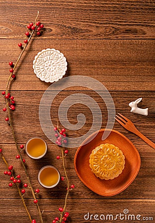 Creative Moon cake Mooncake table design - Chinese traditional pastry with tea cups on wooden background, Mid-Autumn Festival Stock Photo