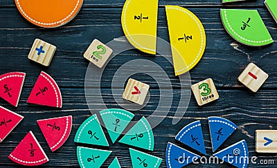 Creative Ð¡olorful math fractions on dark background. Interesting funny math for kids. Education, back to school concept Stock Photo