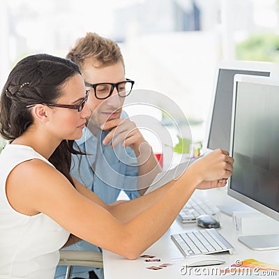 Creative partners working together at their desk Stock Photo