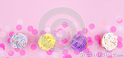 Creative pastel fantasy holiday card with cupcake and confetti. Stock Photo