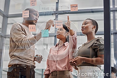 Creative people, coach and planning with team on glass board for notes, tasks or mindmap at office. Group of employees Stock Photo