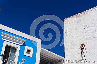 Creative perspective a modern blue and white single-story building wall on a clear sky Stock Photo