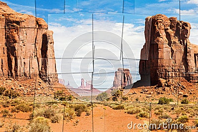 Creative picture of Monument Valley in USA - scenic red landscape with blue sky Stock Photo