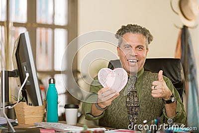 Professional Man Reacting Positively to Valentine Stock Photo