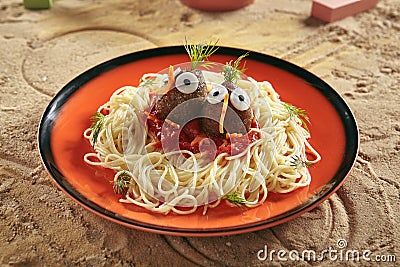 Creative Serving Kids Food with Noodles, Tomato Sauce and Meat Balls Stock Photo