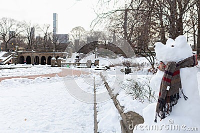 Creative Snowman in the form of a Snow Bear with a Scarf at Bethesda Terrace in Central Park in New York City during Winter Stock Photo