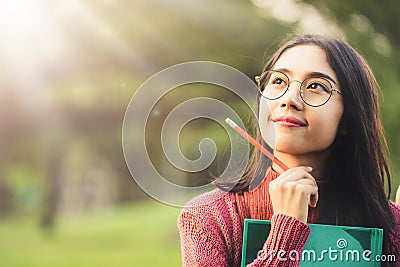 Creative student girl thinking or planning future. Stock Photo