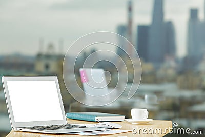 Creative table with empty white laptop Stock Photo