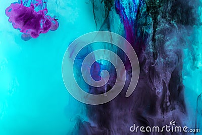 creative texture with turquoise and purple swirls of paint in water Stock Photo