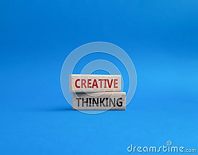 Creative thinkig symbol. Wooden blocks with words Creative thinkig. Beautiful blue background. Business and Creative thinkig Stock Photo