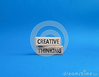 Creative thinkig symbol. Wooden blocks with words Creative thinkig. Beautiful blue background. Business and Creative thinkig Stock Photo