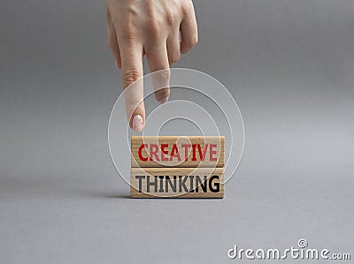 Creative thinkig symbol. Wooden blocks with words Creative thinkig. Businessman hand. Beautiful grey background. Business and Stock Photo