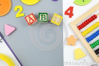 Creative trendy colors ABC, numbers, shapes, fractions on gray background. Interesting funny preschool games Stock Photo