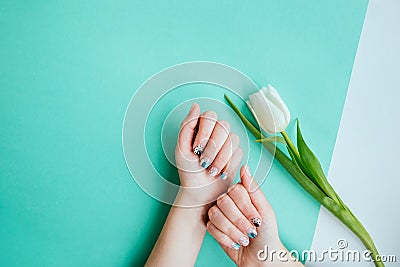 Spring manicure with tulip Stock Photo