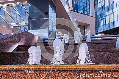 Creative water feature design ideas for waterfall fountain on stairway of entrance group of building Stock Photo