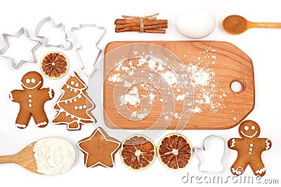 Creative winter time baking background. Kitchen utensils and ingredients for christmas homemade gingerbread cookies on white Stock Photo