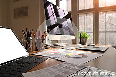 Creative workspace computer and tablet with colour space on artist desk Stock Photo