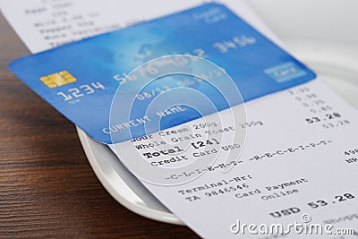 Credit card on shopping receipt Stock Photo