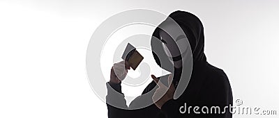 Credit cards personal data stolen by anonymous man in Black hood shirt Stock Photo