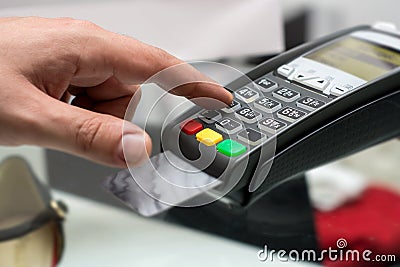 Credit or debit card password payment. Customer hand is entering Stock Photo