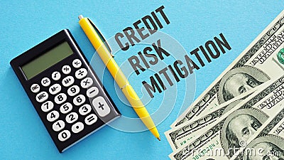 Credit risk mitigation is shown using the text and photo of dollars Stock Photo