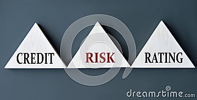 CREDIT RISK RATING - words on wooden triangles on dark background Stock Photo