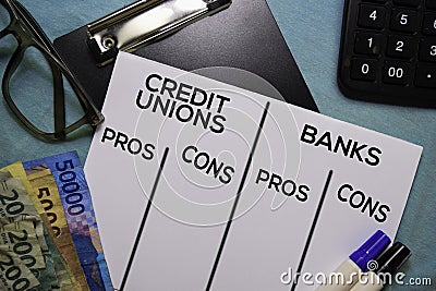 Credit Unions Vs Bank text on Document form isolated on office desk. Pros and cons Stock Photo