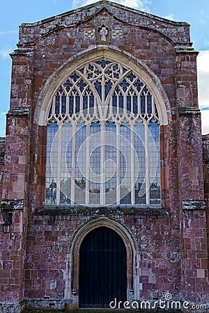 Crediton Parish Church of the Holy Cross and the Mother of Him Who Hung thereon as seen from back entrance with stained glass, Stock Photo