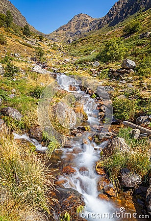 Creek Flowing in a Mountain Landscape Stock Photo