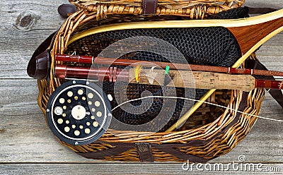 Creel filled with trout fishing equipment Stock Photo