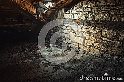 Creepy attic interior at abandoned building Stock Photo