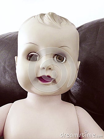 Creepy baby doll Stock Photo