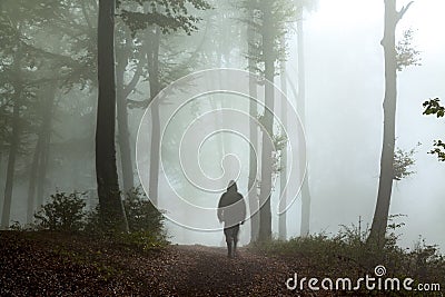 Creepy dark man in the forest Stock Photo