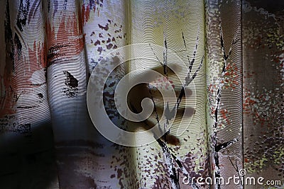 A creepy hand behind a curtain. The fear of burglary or monsters Stock Photo