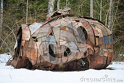 Creepy man face in a wood lying on the snow Editorial Stock Photo