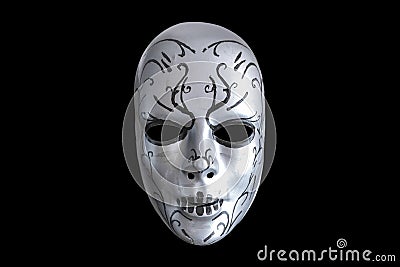 Creepy mask on the black background Stock Photo