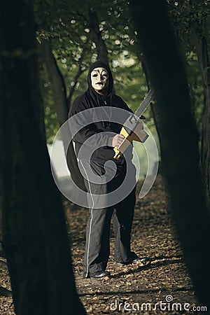 Creepy serial killer with chainsaw Stock Photo