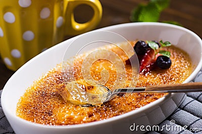 Creme Brulee Dessert with Strawberry, Blueberry and Fresh Mint Leaves Stock Photo